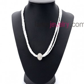 Pure necklace with many small size measles in white and rhinstone ball