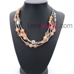 Delicate suit of necklace with many acrylic beads and ccb in orange color


