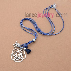 Fashion necklace with blue measles and skull and flower pendant
 
