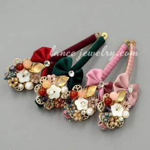 Classic hair clip decorated with rhinestone and a bowknot of fabric