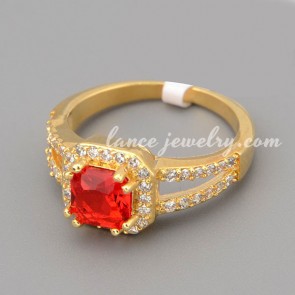 Glittering ring with many shiny cubic zirconia in the quadrangle shape