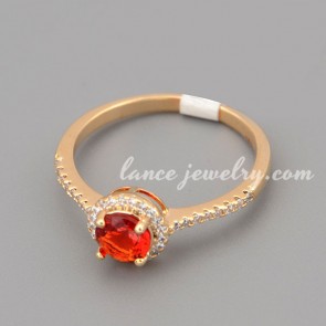 Glittering ring with red cubic zirconia in the circle shape