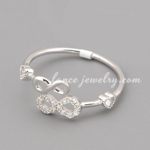 Elegant ring with many shiny cubic zirconia in the double figure 8 shape 