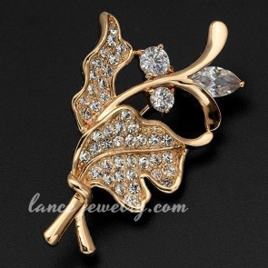 Attractive brass alloy brooch with rhinestone decoration