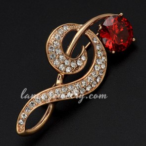 Unique brass alloy brooch decorated with red rhinestone