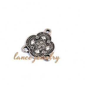 Zinc alloy pendant,a 17mm round pendant shaped flower with four petals and three holes 