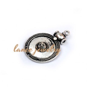 Zinc alloy pendant,a 6g round pendant with a drum on the one side, a circle in the middle and line pattern in the edge