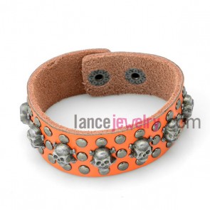 Personality bracelet with orange 
 leather decorated many skeleton and alloy snap fastener 