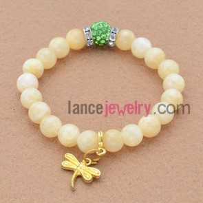 Fashion rhinestone decorated bead bracelet with dragonfly pendant.