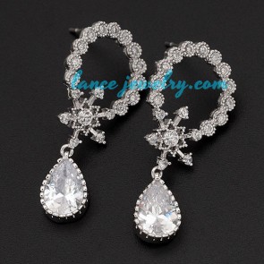 Circular brass alloy earrings with cubic zirconia decoration