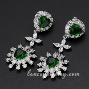 Innovative brass alloy earrings decorated with green cubic zirconia