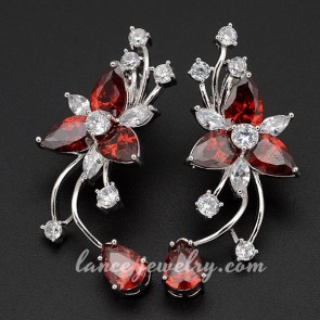 Lovely flower shape earrings decorated with red cubic zirconia