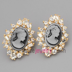 Special stud earrings with gold brass  decorated shiny rhinestone and cubic zirconia with beautiful woman