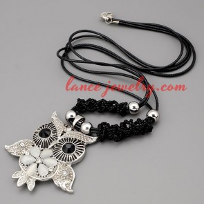 Dazzling necklace with black hide rope & owl pendant 