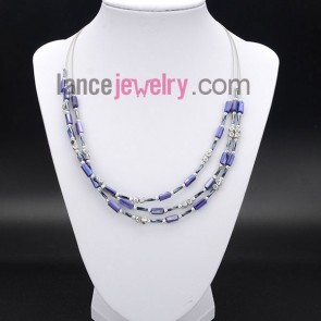 Romantic necklace with shining purple 
shell beads 
