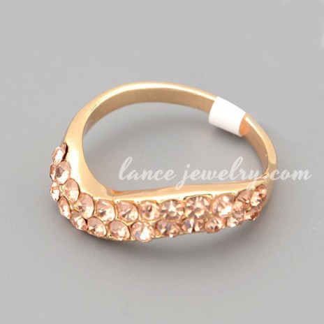 Shiny ring with many gold rhinestone decorated