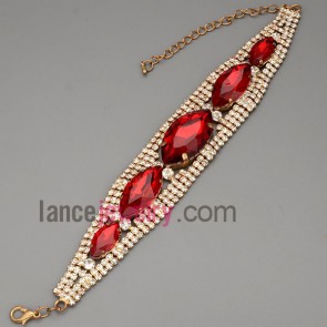 Trendy bracelet with brass claw chain decorated shiny rhinestone and red crystal 
