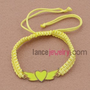 Yellow weaving bracelet with heart parts
