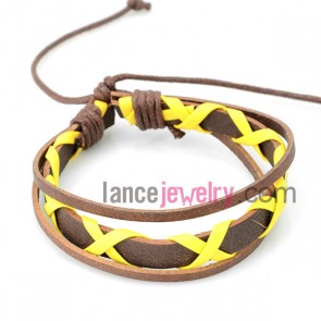Shiny bracelet with brown  leather decorated bright yellow 
rubber
