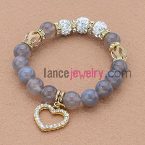 Special alloy parts and rhinestone bead bracelet with love heart pendant.