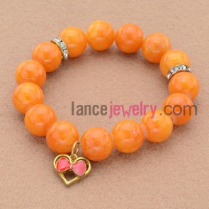 Fashion orange color stone&rhinestone bead bracelet with love heart pendant.