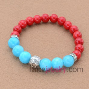 Trendy rhinestone decorated bead bracelet.