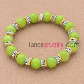 Fashion rhinestone and alloy findings decorated bead bracelet.