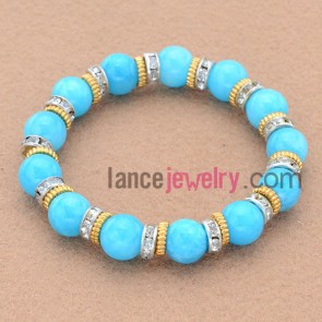 Fashion rhinestone and alloy findings decorated bead bracelet.