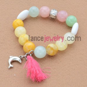 Special bead bracelet with alloy dolphin pendant and tassels.