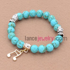 Special alloy findings bead bracelet with music symbol pendant.