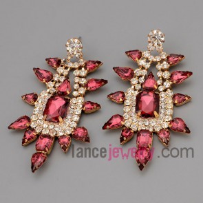 Glittering earrings with claw chain decorate many rhinestone and deep red crystal
