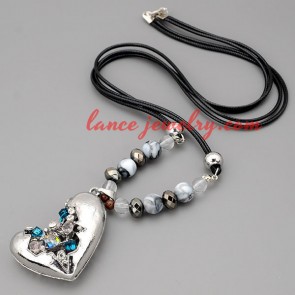 Cool necklace with black hide rope & broken heart pendant 