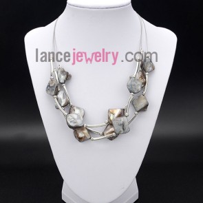 Romantic necklace with irregular shell and brass
