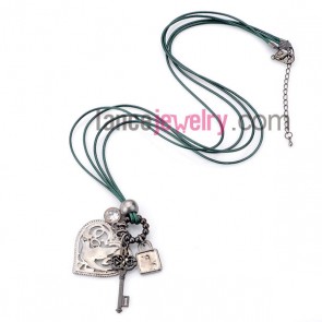 Sweet  necklace with green wax rope and different alloy pendant  

