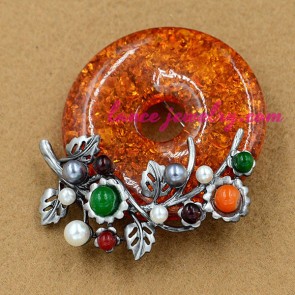 Distinctive orange color resin beads decorated brooch
