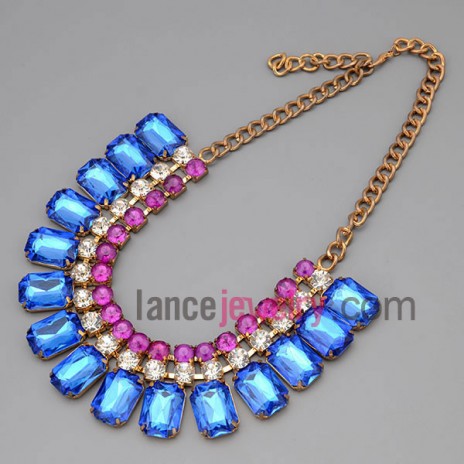 Dazzling necklace with gold metal chain and brass parts and shiny rhinestone and different color crystal 
