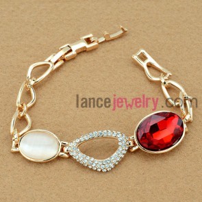 Elegant bracelet with red color crystal and cat eye