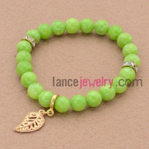 Delicate green color&rhinestone decorated bead bracelet with leaf pendant.