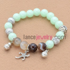 Delicate alloy findings bead bracelet with starfish and calabash pendant.