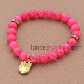Hot pink color bead bracelet with lovely owl pendant.