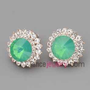 Romantic stud earrings with gold brass decorated shiny rhinestone and light green crystal