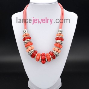 Glittering necklace with silver rings and red acrylic beads and ccb
